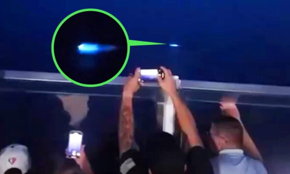 Passengers observing mysterious blue lights at sea