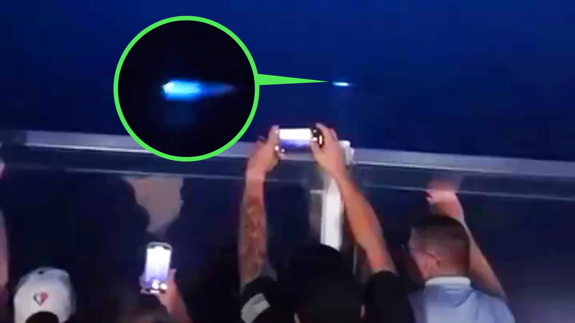 Passengers observing mysterious blue lights at sea